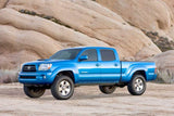 Fabtech 05-14 Toyota Tacoma 2WD/4WD 6 Lug 3in UCA System w/DL 2.5 Resi Coilovers & Rear DL Shocks - K7036DL