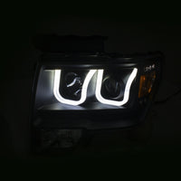 ANZO 2009-2014 Ford F-150 Projector Headlights w/ U-Bar Switchback Black w/ Amber - 111383
